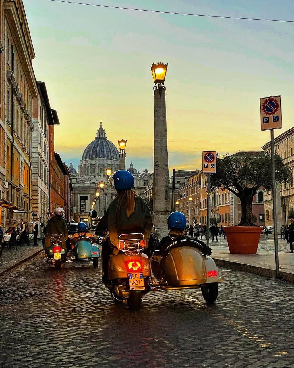 Vespa scooter parked on a street in Rome